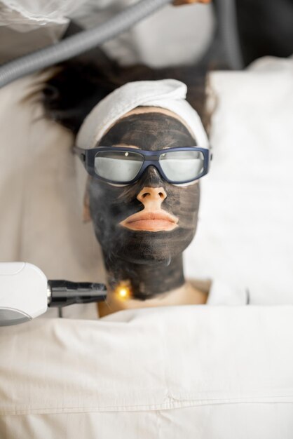 beauty-procedure-laser-carbon-peeling-womans-face_506452-21385